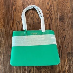 large, green, kate spade tote. includes a detachable polka dot wristlet.